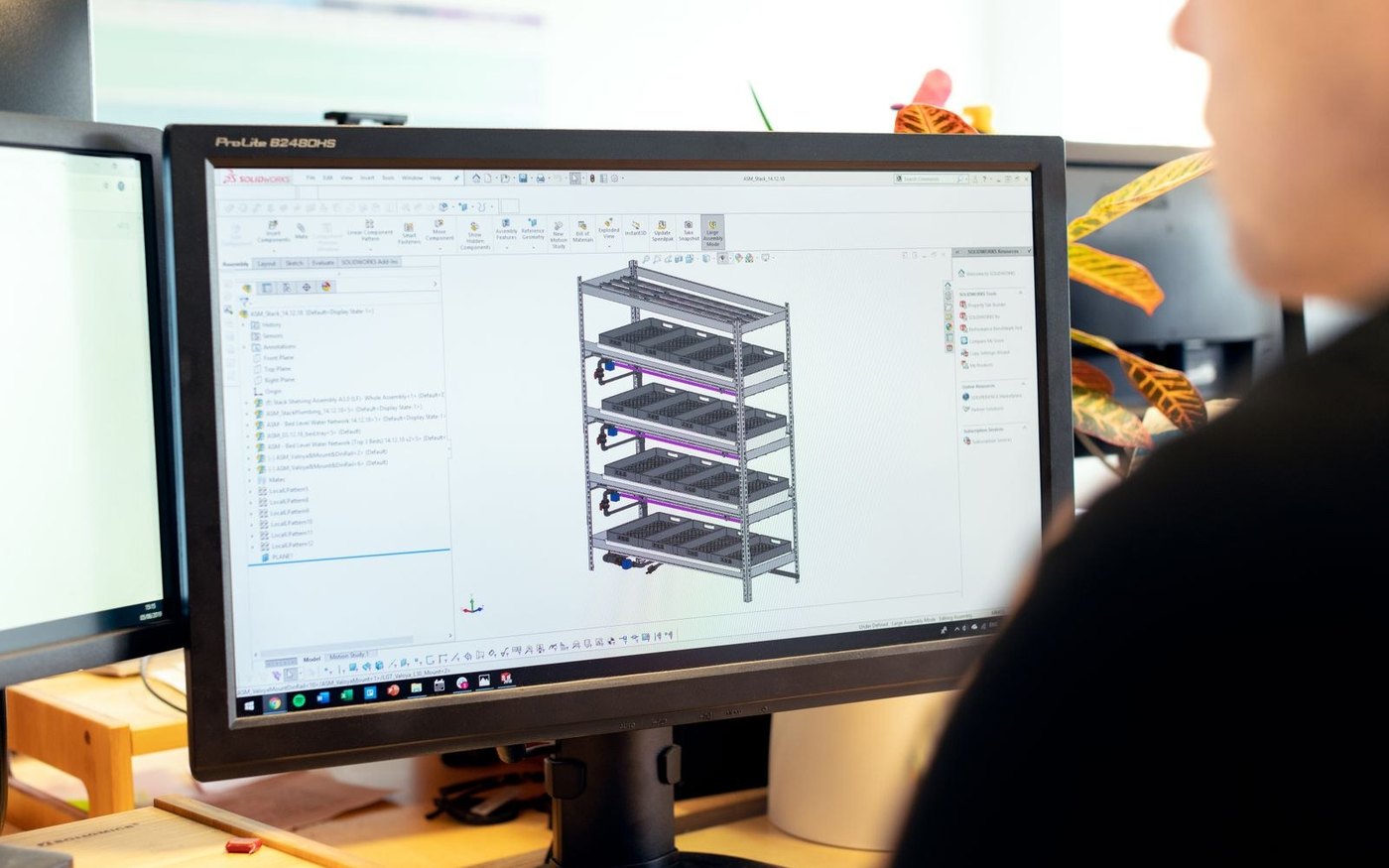 Engineer modelling a 3D assembly in CAD — BoardTech mechanical design services